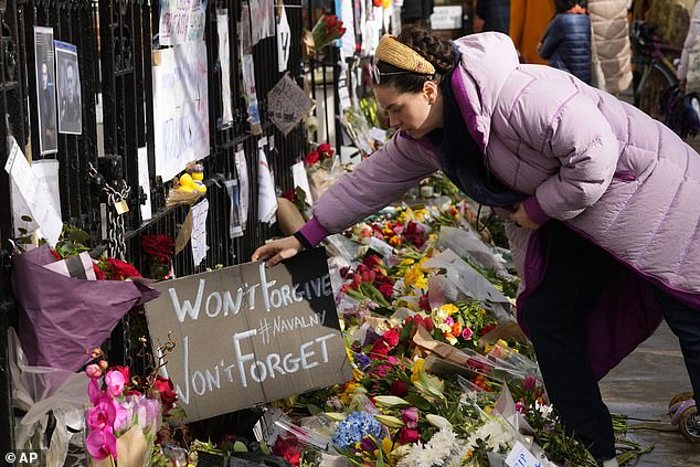 Russia begins jailing hundreds of protesters for laying flowers and candles in memory of 