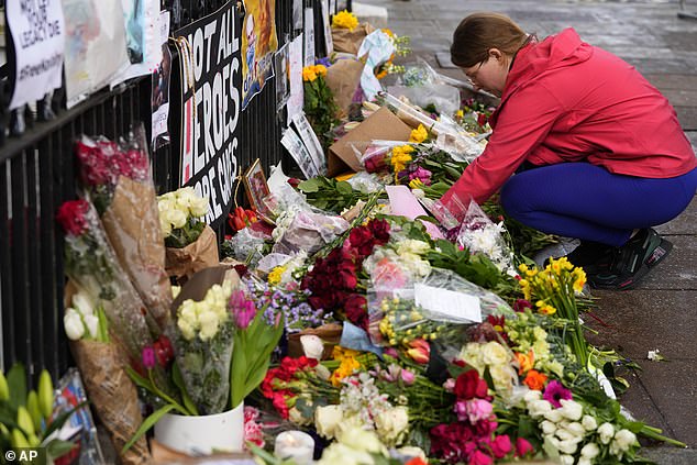 Russia begins jailing hundreds of protesters for laying flowers and candles in memory of 