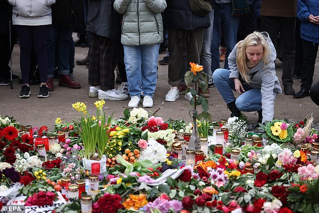 Russia begins jailing hundreds of protesters for laying flowers and candles in memory of 