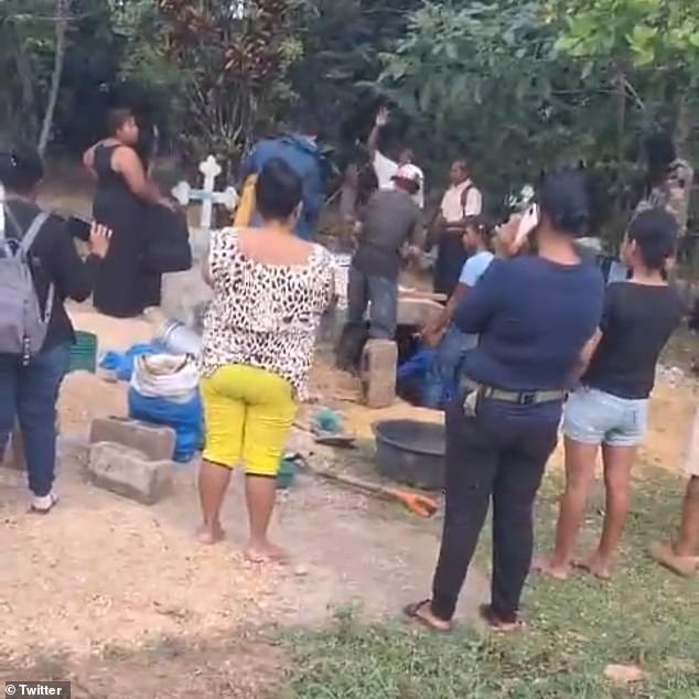 Parents exhume corpse of daughter, 24, out of cemetery after they received a call to her cellphone from someone claiming�