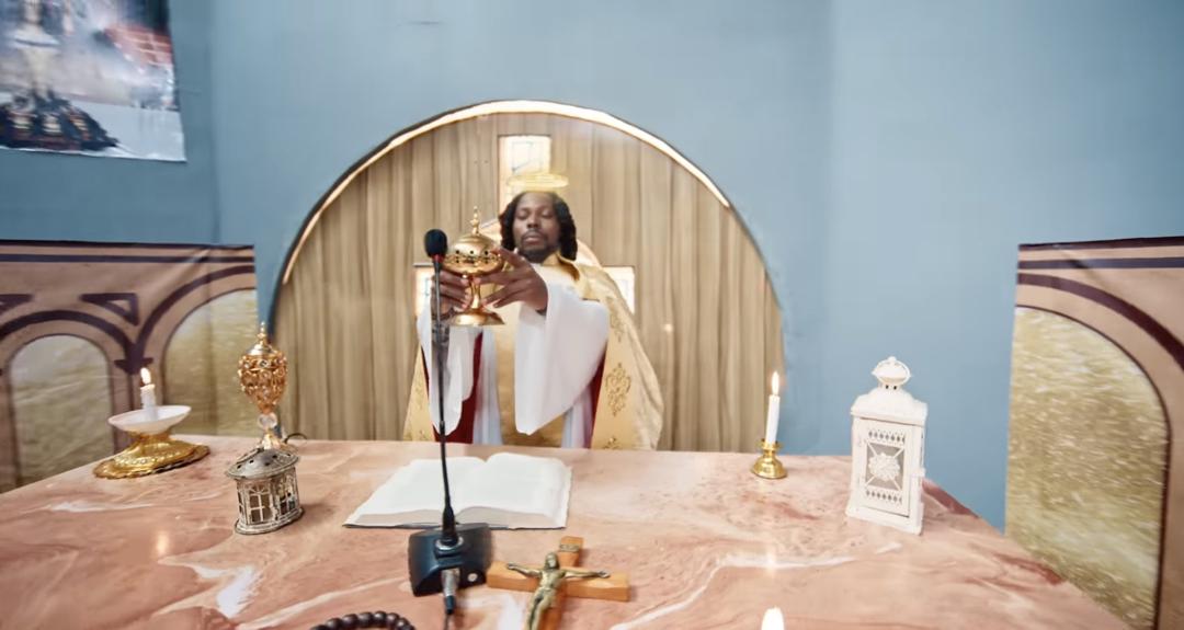 Dramatizing giving the Eucharist for a music video that has no connection with Christianity is disrespectful - Solomon Buchi slams Asake