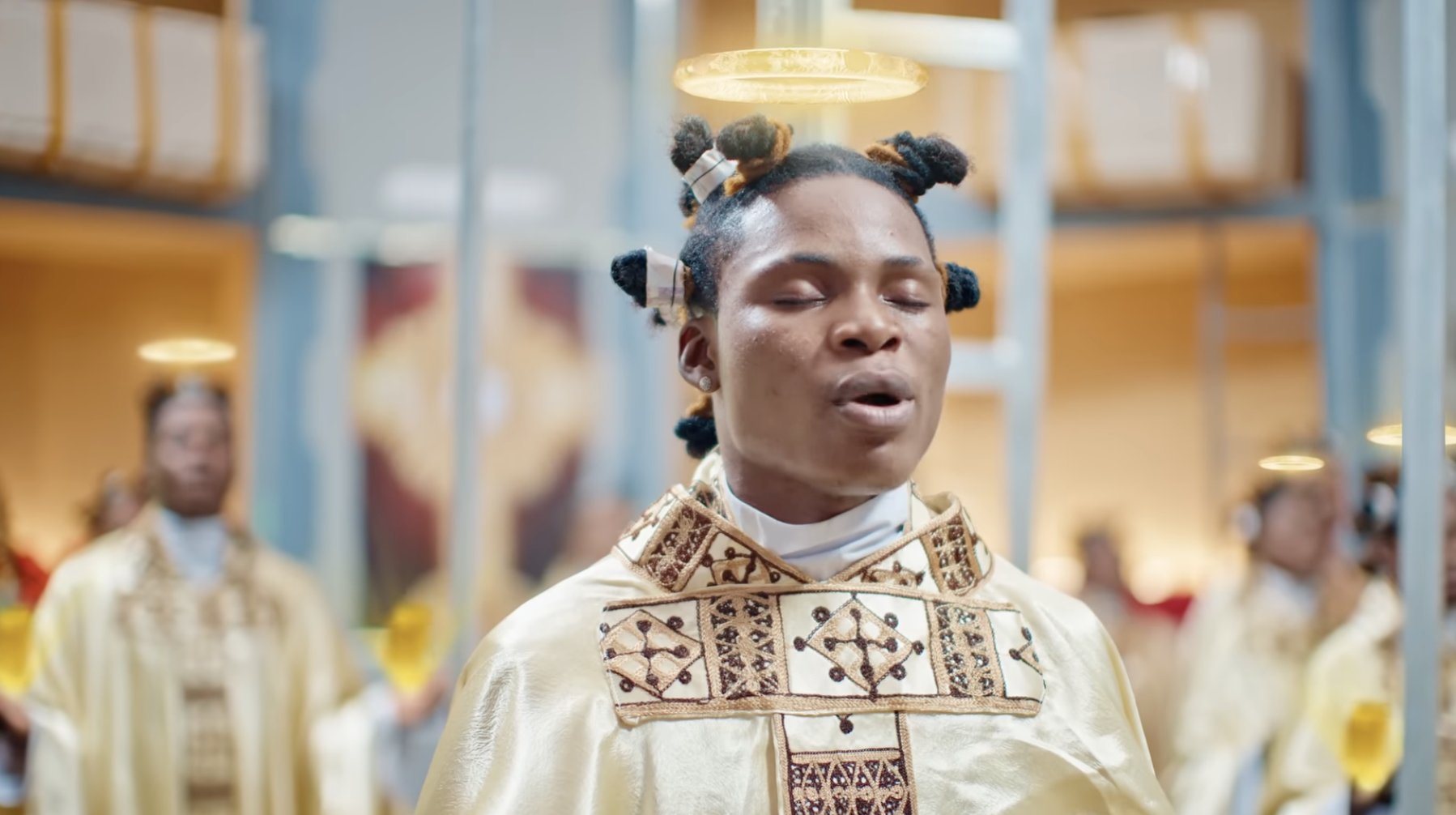 Dramatizing giving the Eucharist for a music video that has no connection with Christianity is disrespectful - Solomon Buchi slams Asake