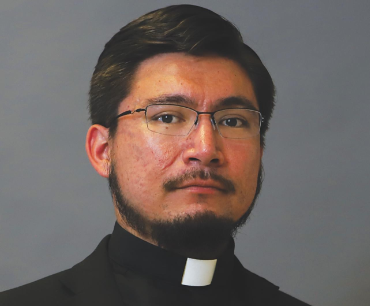 Catholic priest arrested and charged with indecency with children