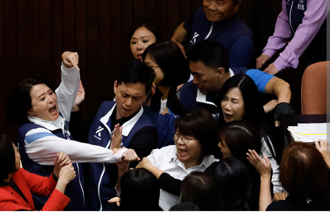 Taiwan lawmakers tackle each other and exchange blows in bitter dispute over parliament reforms (video)