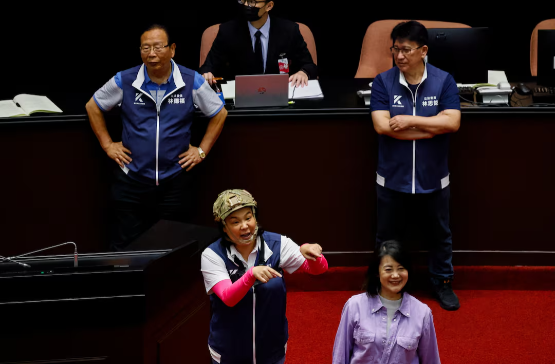 Taiwan lawmakers tackle each other and exchange blows in bitter dispute over parliament reforms (video)