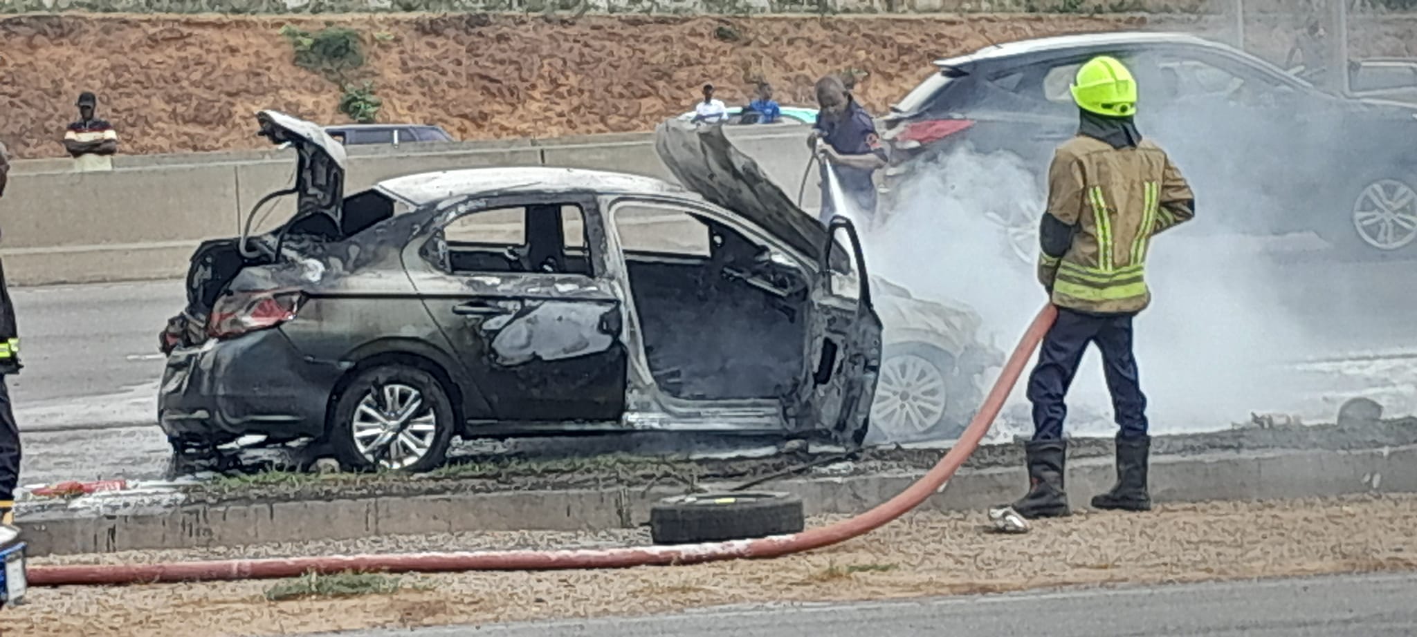 Fire guts car on Abuja airport road (video)