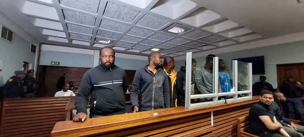 Bail denied for eight Nigerian nationals accused of assaulting cops and damaging police station in South Africa