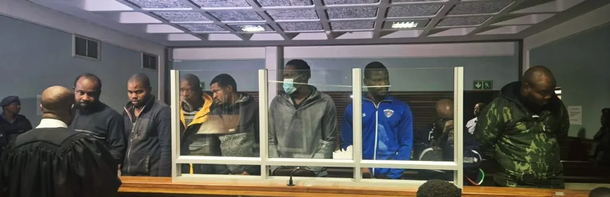 Bail denied for eight Nigerian nationals accused of assaulting cops and damaging police station in South Africa