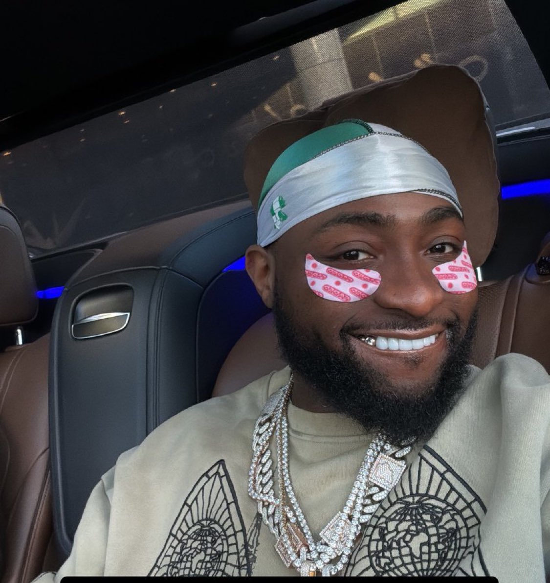 Davido wears Nigerian flag on his head to interview after receiving heat for speaking about the poor state of Nigeria